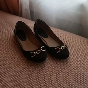 Black flats with gold detail